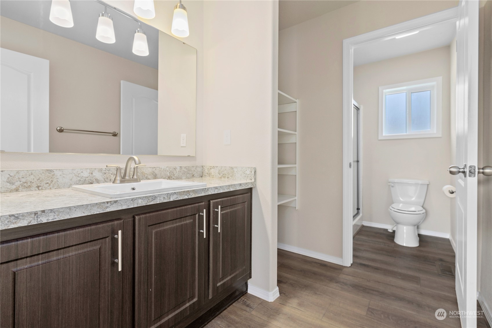 4701 Devonshire Drive Anacortes, WA 98221 - Photo 10 of 24 a bathroom with a granite countertop sink a toilet and a granite
