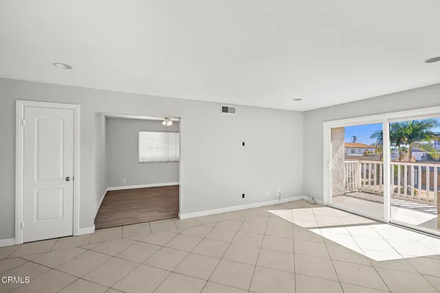 a view of an empty room and window