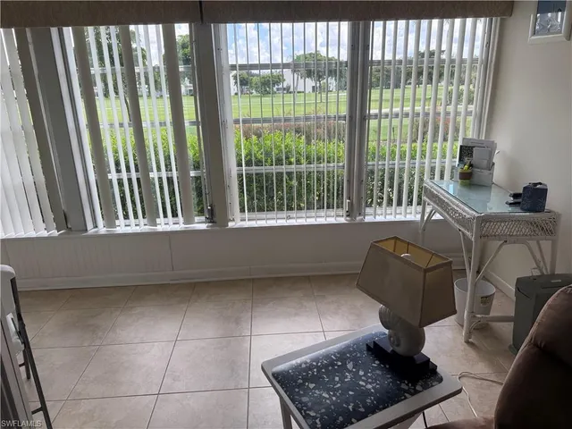 a room with furniture and a window