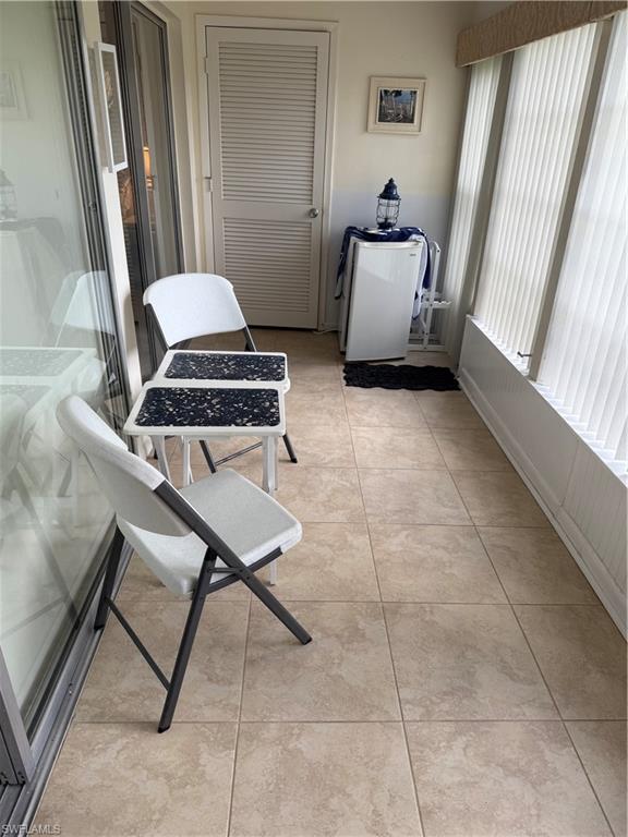 315 St Andrews Boulevard, Unit A2 Naples, FL 34113 - Photo 17 of 17 a room with furniture and a window