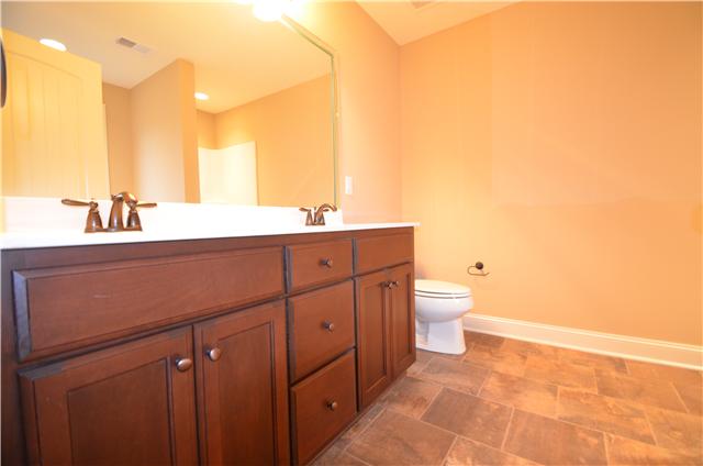 120 Legends Ridge Drive, Unit 26 Lebanon, TN 37090 - Photo 11 of 18 Master bath with double vanities and tile flooring
