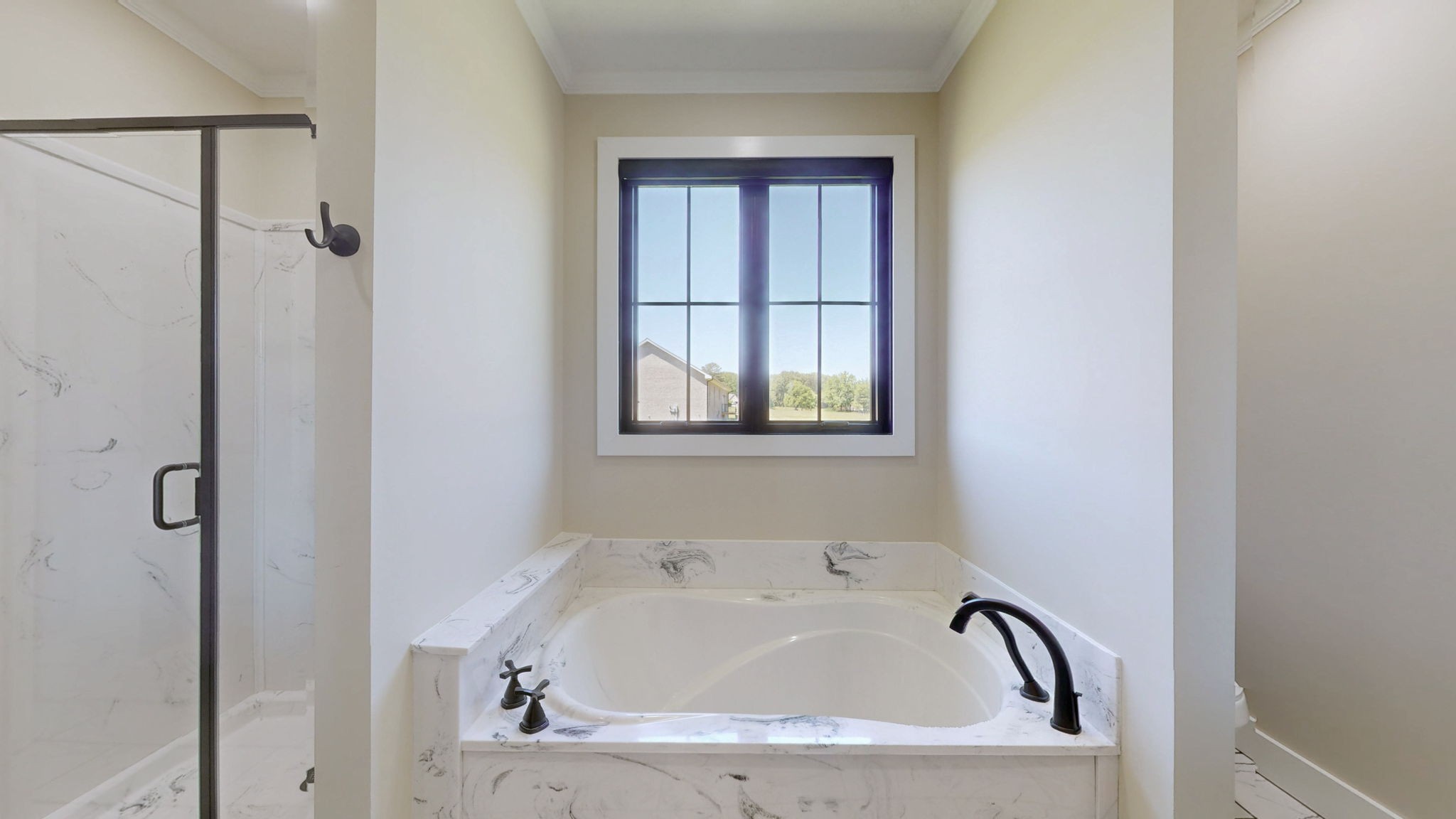 865 Alman Cemetery Road Paris, TN 38242 - Photo 15 of 41 a bathroom with a tub and shower