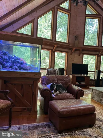 a outdoor dining space with furniture and wooden floor