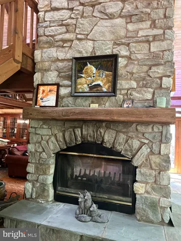 a view of a livingroom with workspace and a window