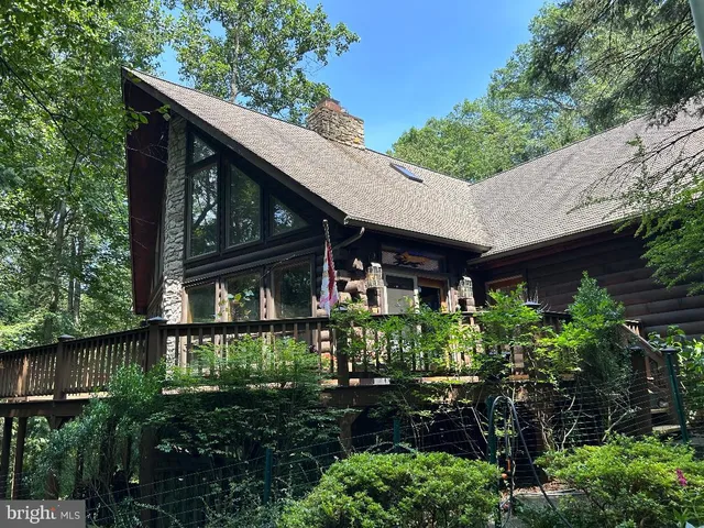 a front view of a house with a yard and fountain
