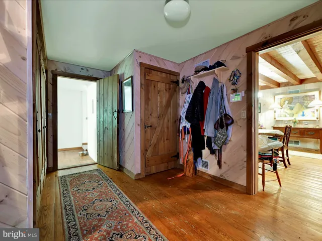 a view of a balcony with wooden floor