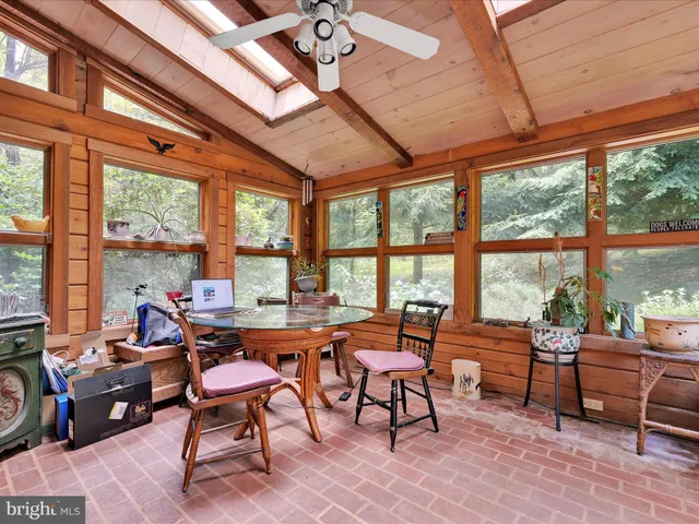 a view of balcony with deck and wooden floor