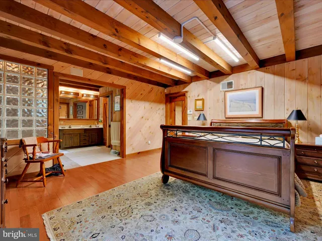 a view of balcony with wooden floor and outdoor seating