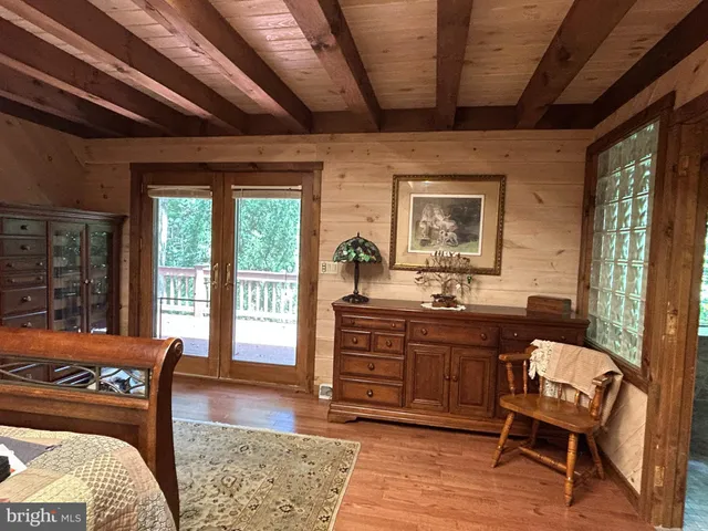 a view of a balcony with wooden floor