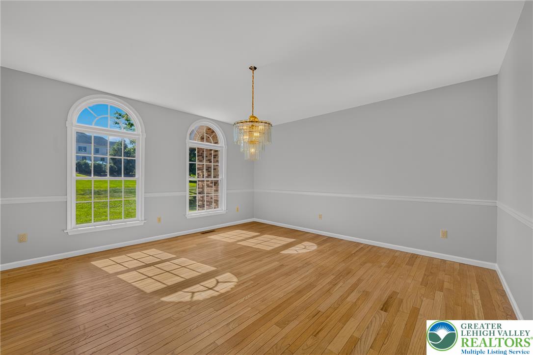 630 Clearfield Road Nazareth, PA 18064 - Photo 23 of 100 Polished hardwood floors and arched multi-pane windows define this bright, versatile room.