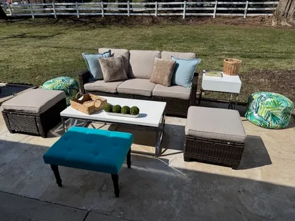 a view of a lake with couches and lounge chairs