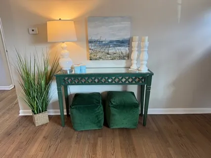 a bedroom with a bed and lamp