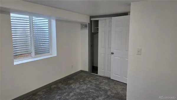 a view of a room that has a window in it