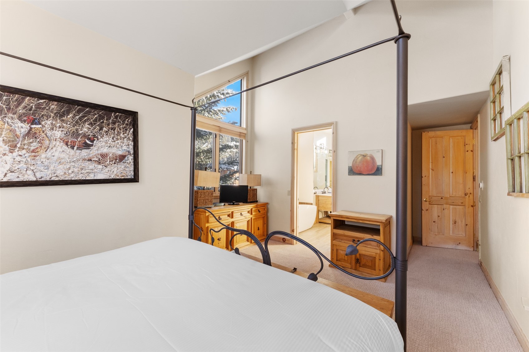 1459 East Keystone Road, Unit C1 Dillon, CO 80435 - Photo 15 of 27 Bedroom with ensuite bathroom and light carpet