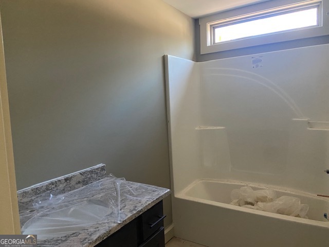 9 Tanvor Trail Cleveland, GA 30528 - Photo 21 of 37 a bathroom with a granite countertop sink and bathtub