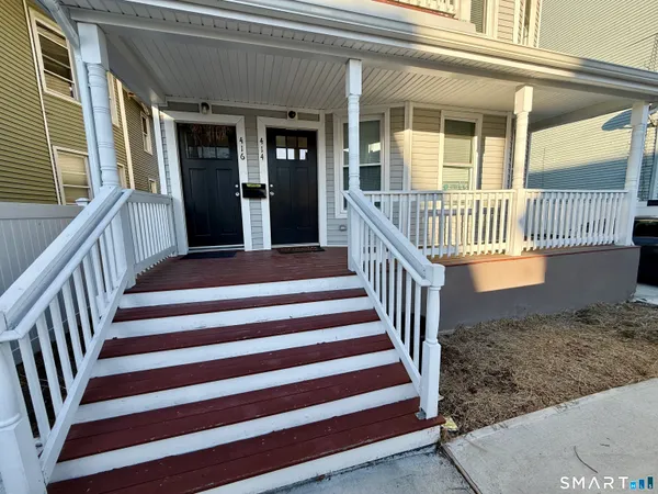 a view of a porch with a floor to ceiling window