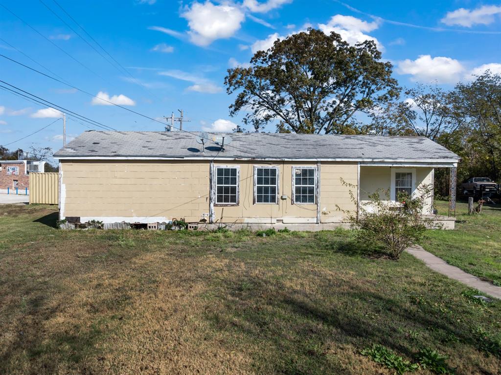 218 North Preston Street Whitney, TX 76692 - Photo 2 of 23 a view of a house with a backyard