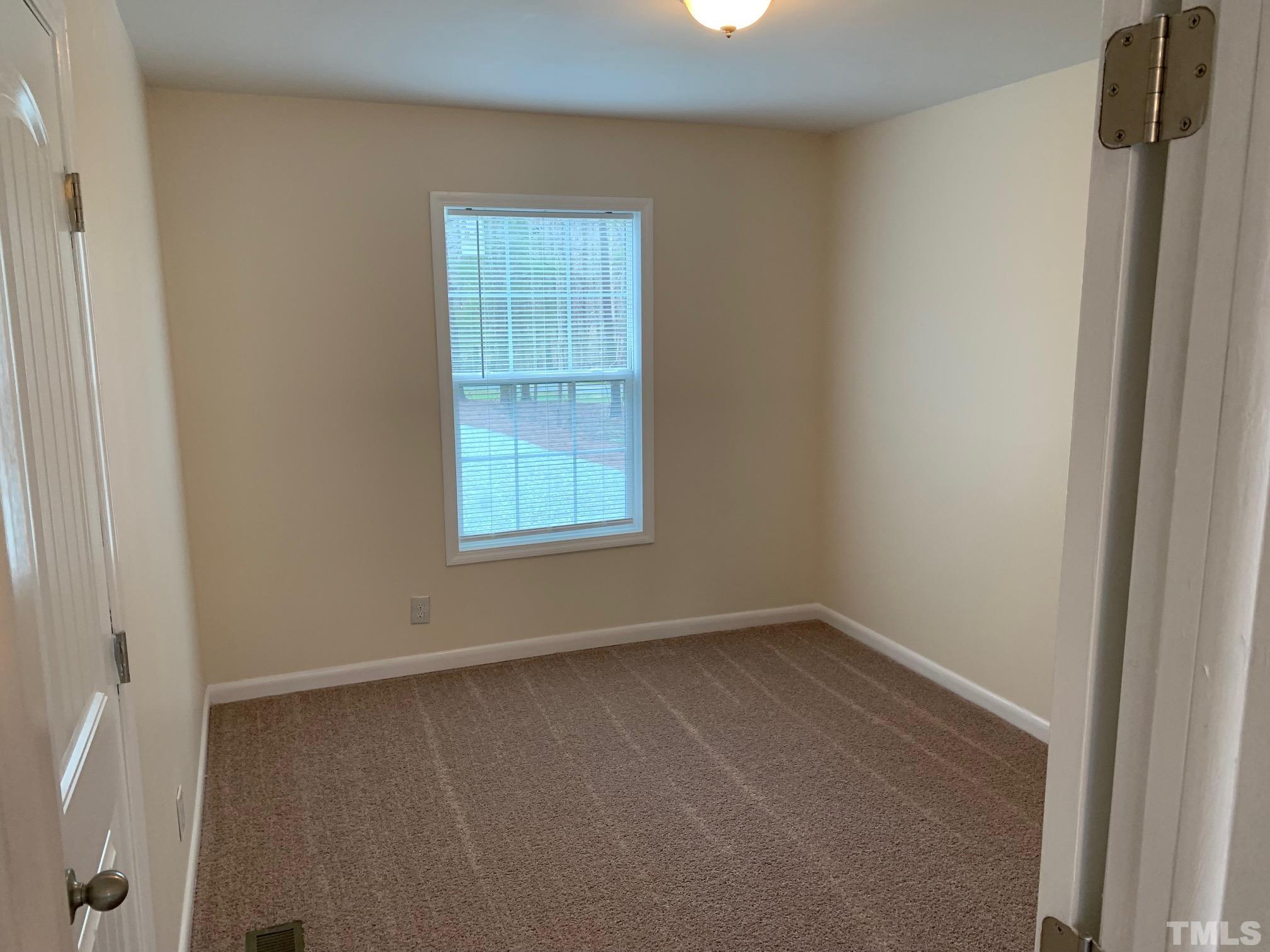 694 Stoney Mountain Road Rougemont, NC 27572 - Photo 12 of 23 an empty room with a window