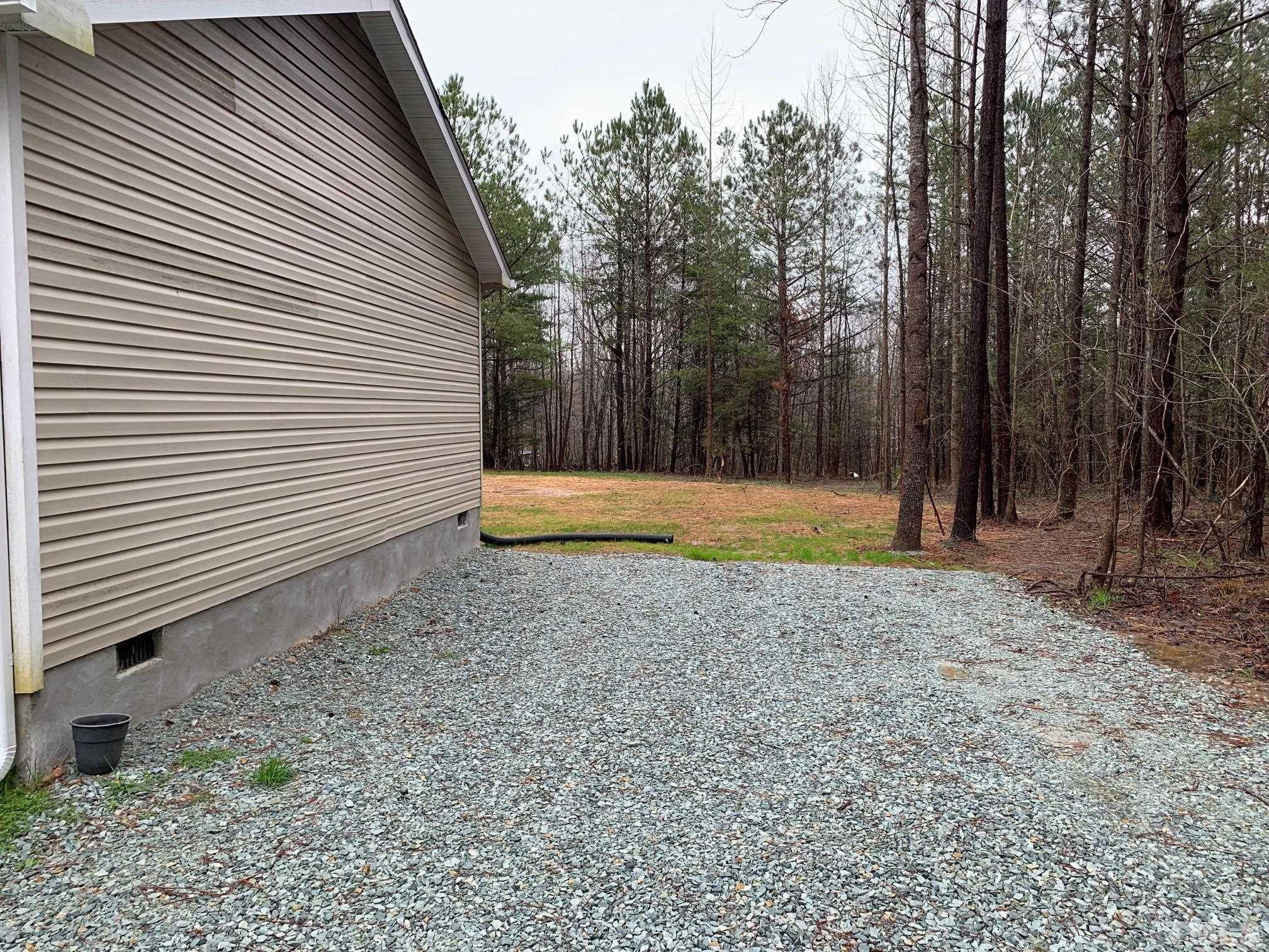 694 Stoney Mountain Road Rougemont, NC 27572 - Photo 18 of 23 a view of backyard with green space