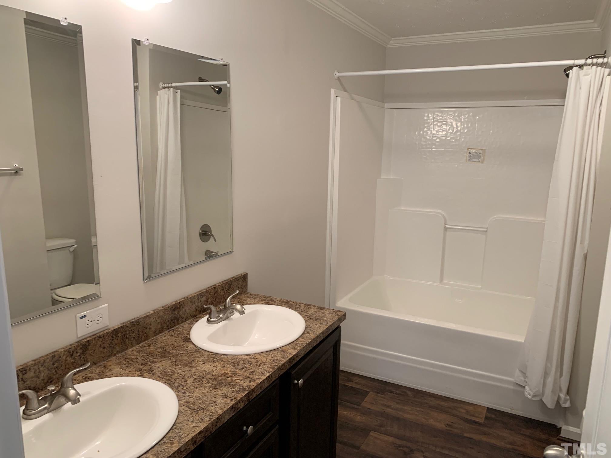694 Stoney Mountain Road Rougemont, NC 27572 - Photo 9 of 23 a bathroom with a granite countertop sink and a mirror