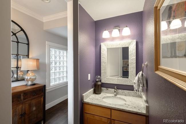 3604 Raleigh Street Denver, CO 80212 - Photo 17 of 38 a bathroom with a sink and a mirror