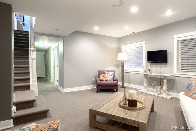 3604 Raleigh Street Denver, CO 80212 - Photo 19 of 38 a living room with furniture and a flat screen tv