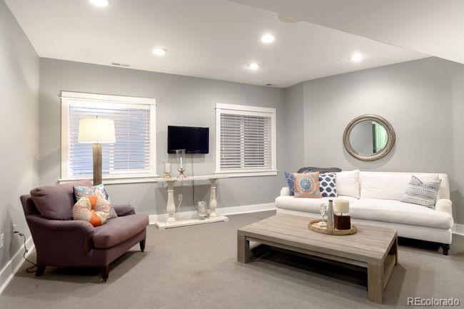 3604 Raleigh Street Denver, CO 80212 - Photo 20 of 38 a living room with furniture and a flat screen tv
