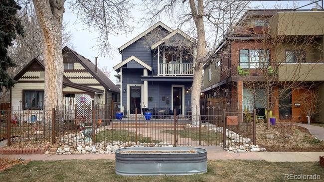 3604 Raleigh Street Denver, CO 80212 - Photo 2 of 38 a front view of a house with garden