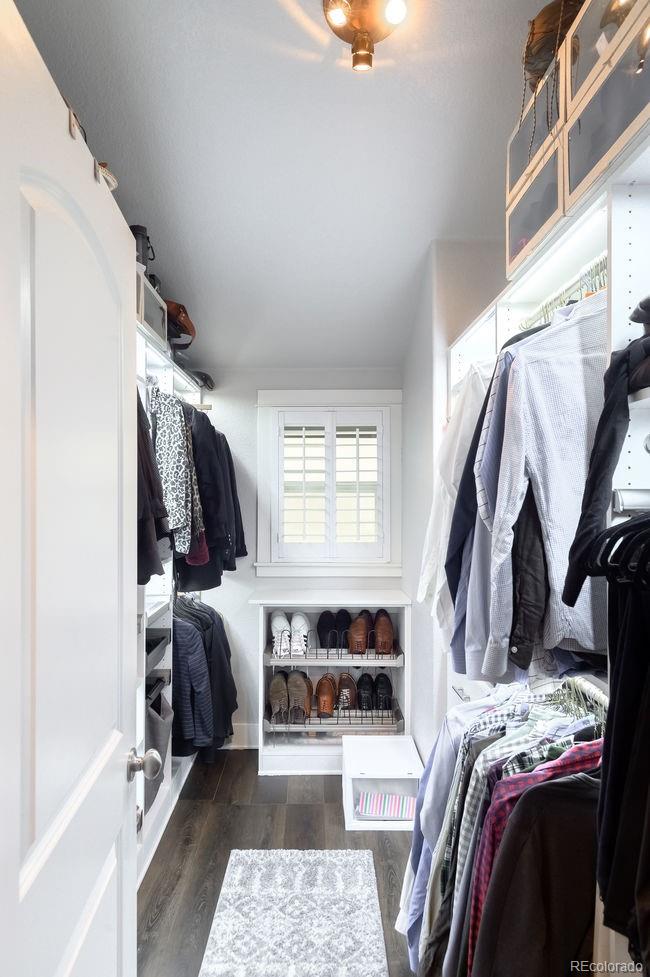 3604 Raleigh Street Denver, CO 80212 - Photo 24 of 38 a view of walk in closet with clothes and shoes