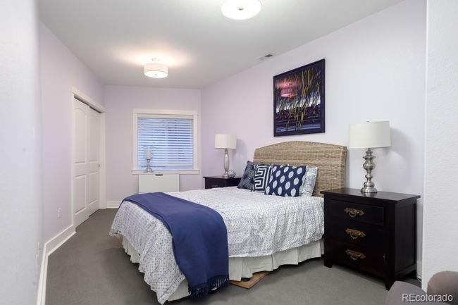 3604 Raleigh Street Denver, CO 80212 - Photo 26 of 38 a bedroom with a bed and a night stand