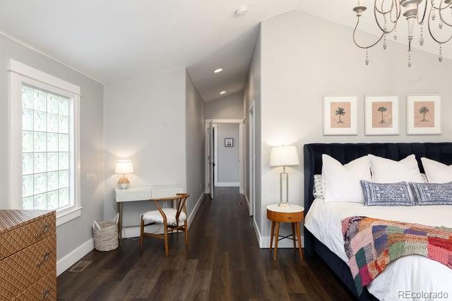 3604 Raleigh Street Denver, CO 80212 - Photo 31 of 38 a bedroom with a bed and wooden floor