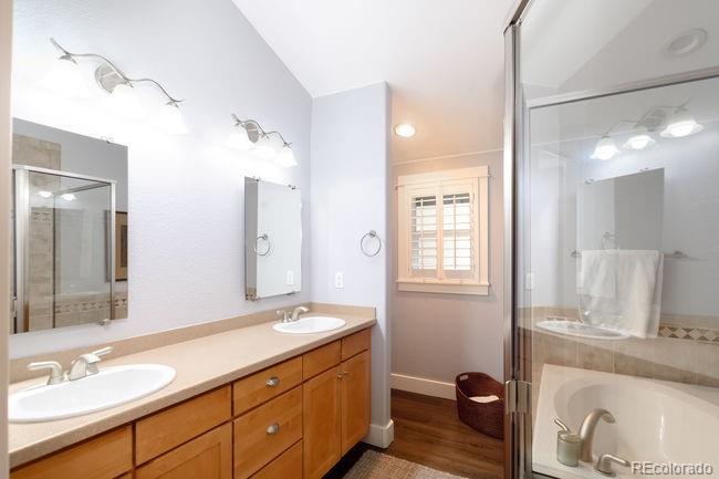 3604 Raleigh Street Denver, CO 80212 - Photo 34 of 38 a bathroom with a granite countertop sink and a mirror