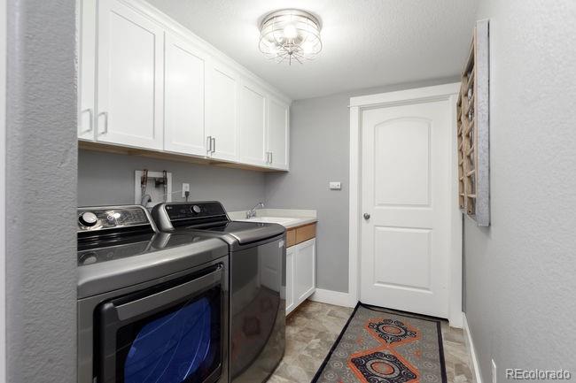 3604 Raleigh Street Denver, CO 80212 - Photo 35 of 38 a kitchen with a stove and a microwave