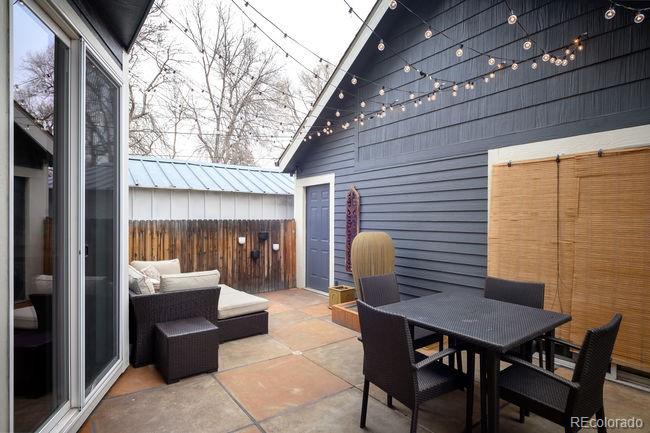 3604 Raleigh Street Denver, CO 80212 - Photo 37 of 38 a backyard of a house with a table and chairs