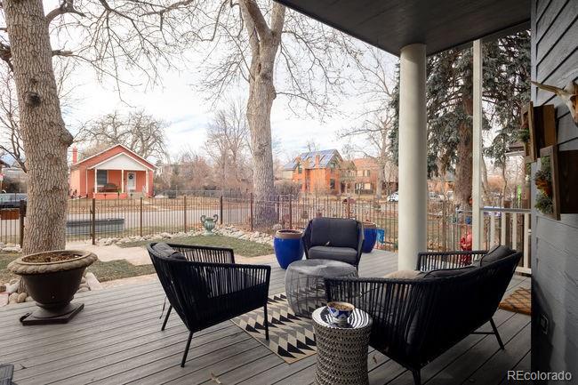 3604 Raleigh Street Denver, CO 80212 - Photo 6 of 38 a roof deck with couches and wooden fence