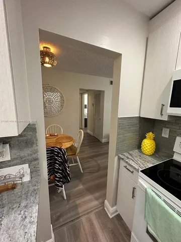 a kitchen with a stove and a sink