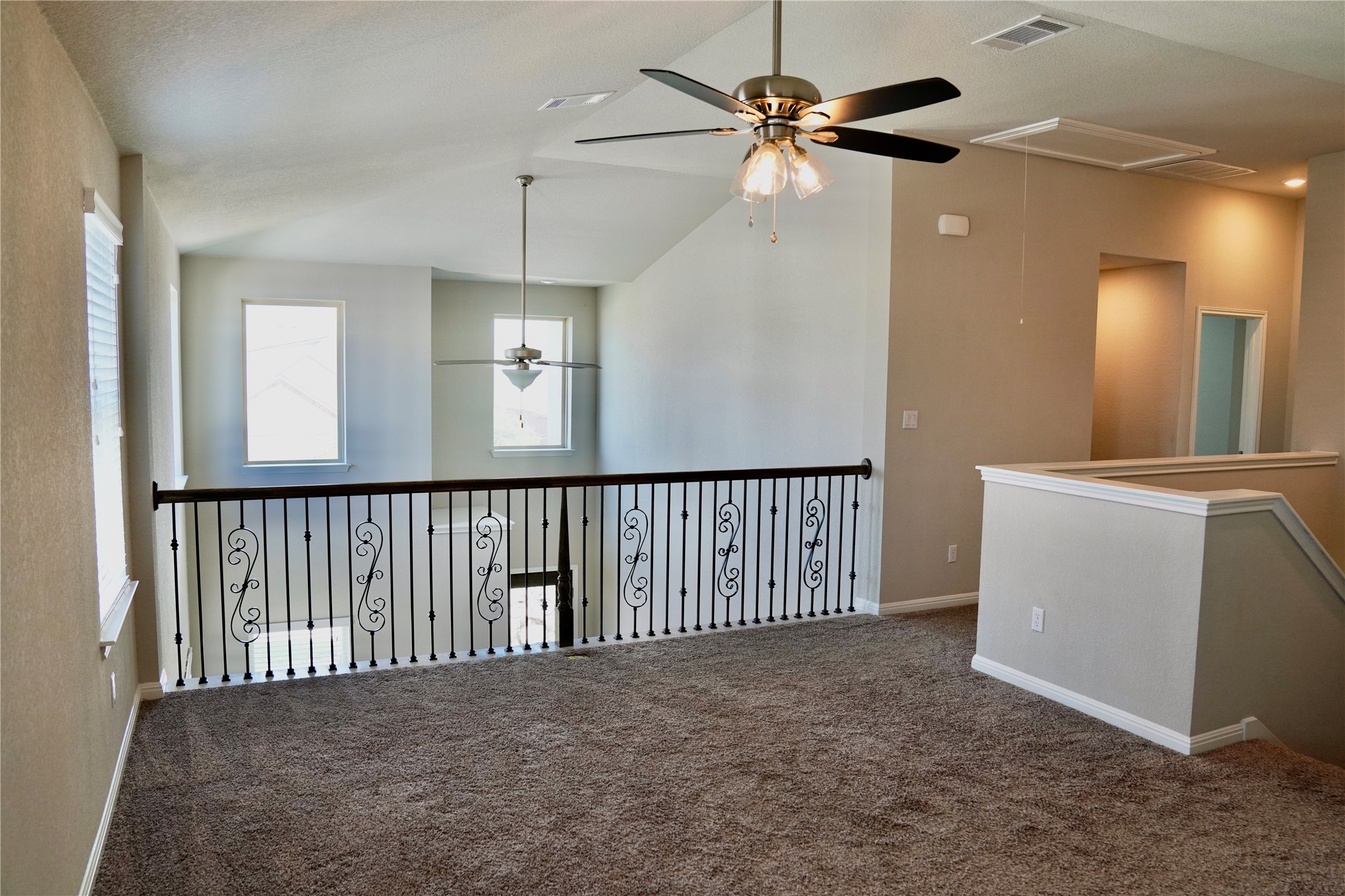 19028 Quebrada Drive Pflugerville, TX 78660 - Photo 6 of 36 en view interior of a house with a chandelier fan
