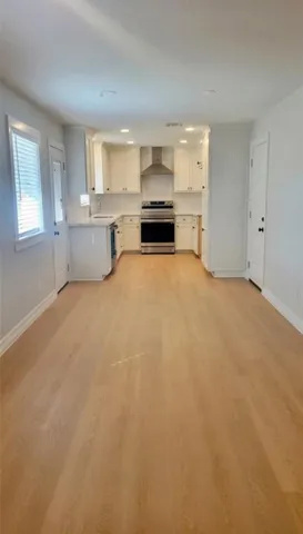 a view of a kitchen with a sink cabinets and a window