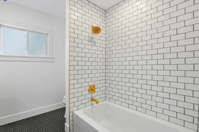 a bathroom with a sink a mirror and a shower