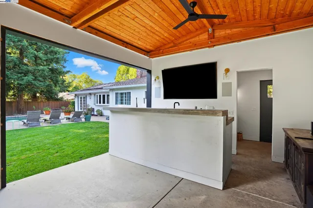 a view of a chairs and a table in backyard