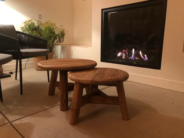 a reading room with furniture and a potted plant