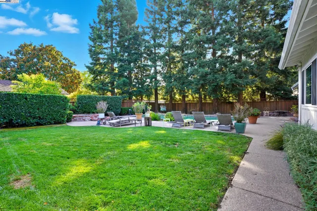 a view of a house with a flower garden