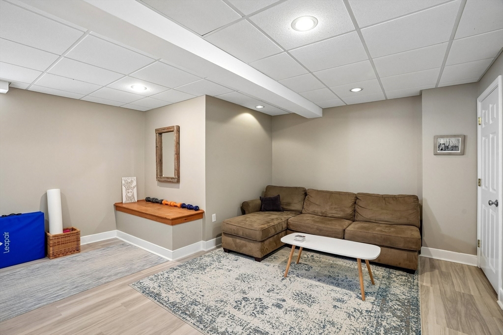 12 Hawley Road Scituate, MA 02066 - Photo 16 of 24 a living room with furniture and a wooden floor
