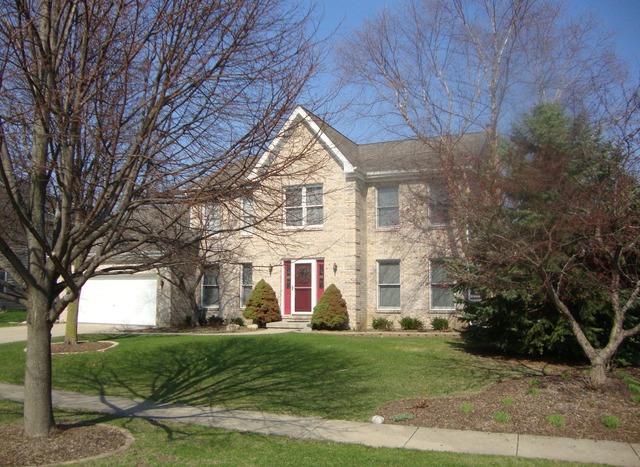1234 Fagan Road Batavia, IL 60510 - Photo 1 of 25 a view of a big house with a big yard and large trees