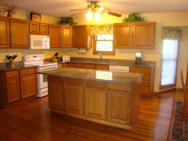 1234 Fagan Road Batavia, IL 60510 - Photo 2 of 25 a kitchen with stainless steel appliances granite countertop wooden cabinets a sink and dishwasher with wooden floor