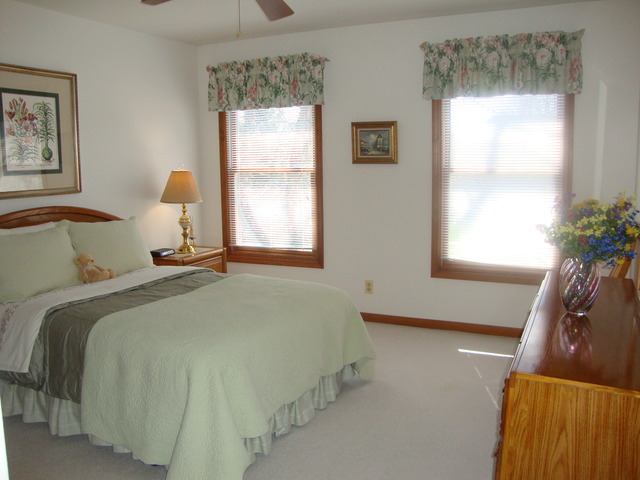 1234 Fagan Road Batavia, IL 60510 - Photo 12 of 25 a bedroom with a bed and window