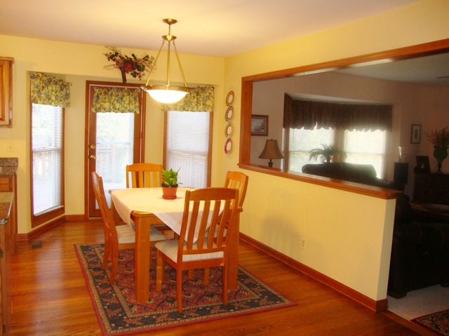 1234 Fagan Road Batavia, IL 60510 - Photo 3 of 25 a view of a dining room with furniture window and wooden floor