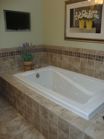 1234 Fagan Road Batavia, IL 60510 - Photo 7 of 25 a bath tub sitting next to a bathroom sink