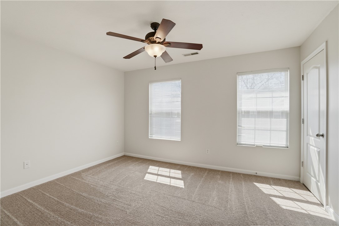 4294 Straight Arrow Road Dayton, OH 45430 - Photo 23 of 41 This spacious bedroom offers ample natural light and a comfortable atmosphere for relaxation.