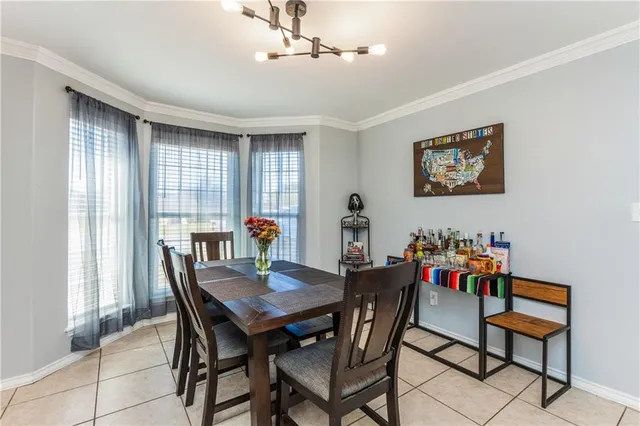 a view of a dining room with furniture and window
